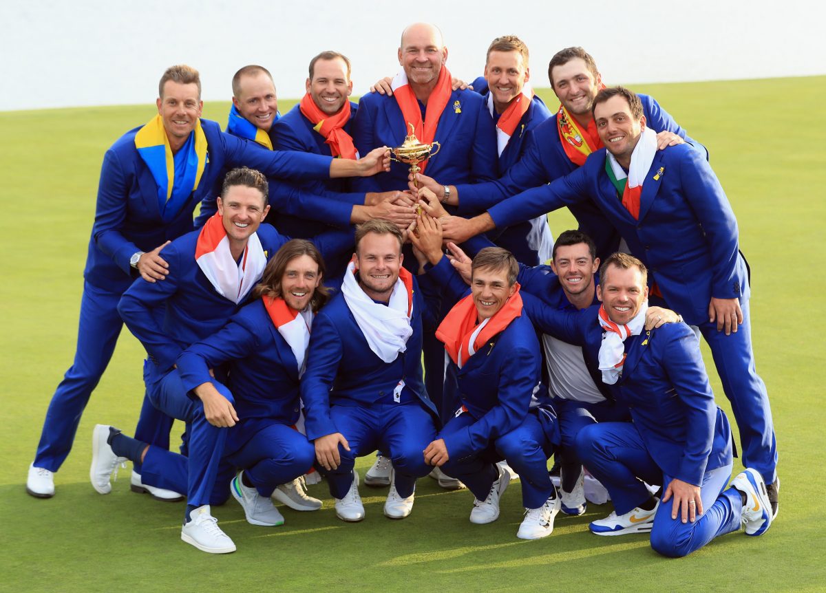 Captain Thomas Bjorn of Europe holds The Ryder Cup trophy as The European Team celebrate victory following the singles matches of the 2018 Ryder Cup at Le Golf National on September 30, 2018 in Paris, France. © Getty Images