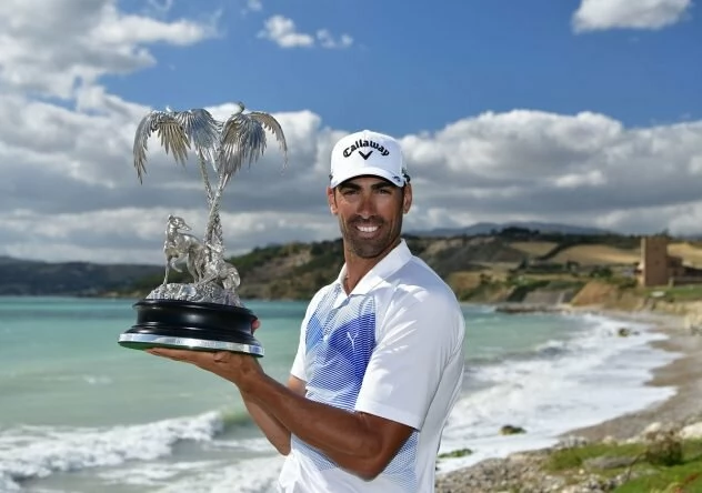 Alvaro Quiros of Spain holds the trophy after winning The Rocco Forte Open at The Verdura Golf and Spa Resort. © Getti Images | Stuart Franklin
