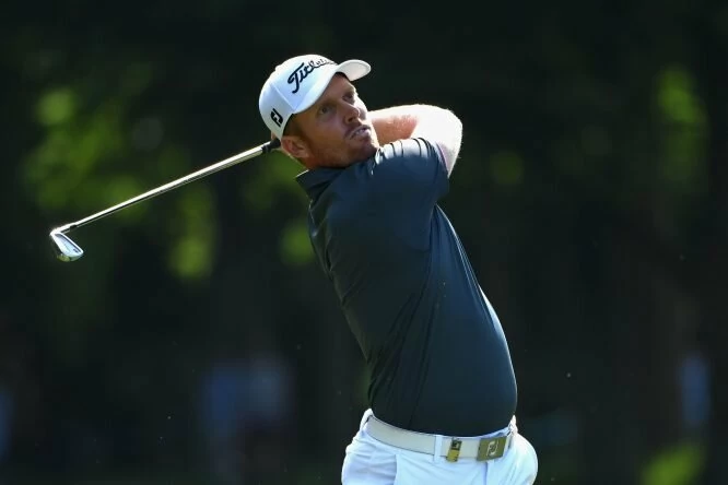 Andrew Dodt of Australia plays his second shot on 17th hole during day three of the BMW PGA Championship at Wentworth. © Getty Images | Ross Kinnaird