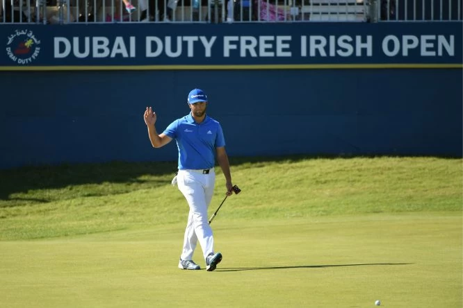 Jon Rahm of Spain acknowledges the crowd on the 18th green during day three of the Dubai Duty Free Irish Open at Portstewart Golf Club on July 8, 2017 in Londonderry, Northern Ireland. (Photo by Ross Kinnaird/Getty Images)