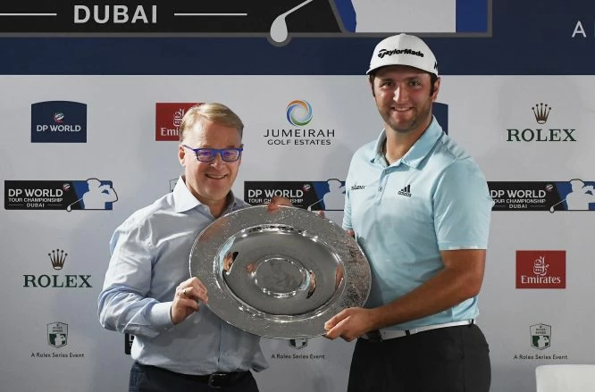 Jon Rahm of Spain is presented with the Rookie of the Year award by European Tour Chief Executive Keith Pelley during the Pro-Am prior to the DP World Tour Championship at Jumeirah Golf Estates on November 14, 2017 in Dubai, United Arab Emirates. (Photo by Ross Kinnaird/Getty Images)