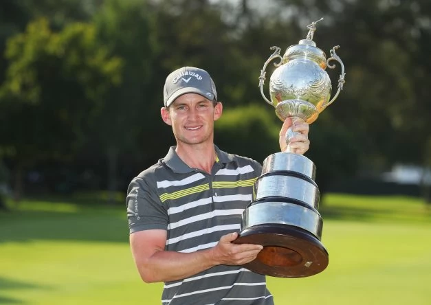 Chris Paisley with the BMW SA Open trophy.