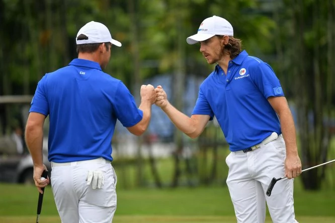 Tommy Fleetwood celebrates with Paul Casey of Europe during the fourballs matches on day one of the 2018 EurAsia Cup presented by DRB-HICOM at Glenmarie G&CC on January 12, 2018 in Kuala Lumpur, Malaysia. (Photo by Stuart Franklin/Getty Images)