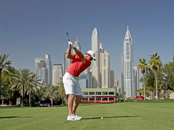 Rory McIlroy of Northern Ireland plays a short iron shot (part of swing sequence frame 4) as a preview for the Omega Dubai Desert Classic on the Majlis Course at The Emirates Golf Club on January 23, 2018 in Dubai, United Arab Emirates. (Photo by David Cannon/Getty Images)