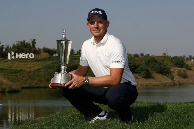 Matt Wallace of England poses for a picture with the trophy after winning the play off during day four of The Hero Indian Open at Dlf Golf and Country Club on March 11, 2018 in New Delhi, India. (Photo by Matthew Lewis/Getty Images)