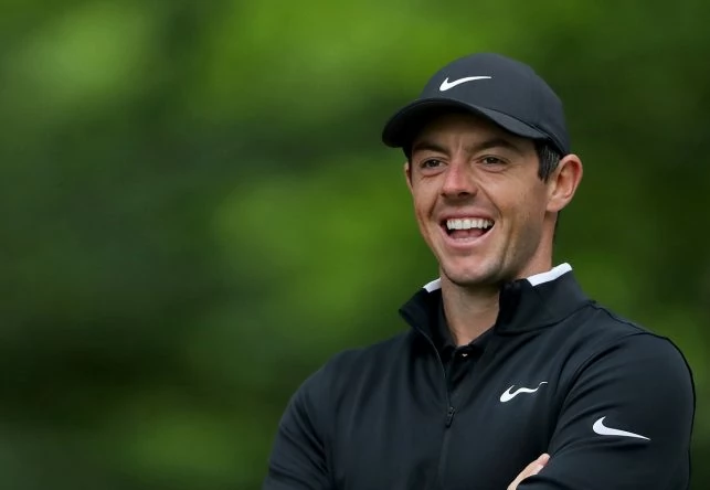 Rory McIlroy of Northern Ireland enjoys a light hearted moment during the pro-am for the 2018 BMW PGA Championship on the West Course at Wentworth on May 23, 2018 in Virginia Water, England. (Photo by David Cannon/Getty Images)