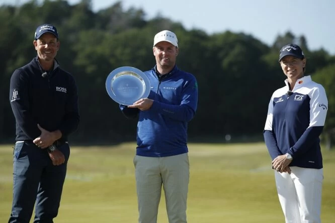 Jonathan Caldwell of Northern Ireland poses with the trophy and Annika Sorenstam and Henrik Stenson of Sweden after his win during the final round of The Scandinavian Mixed Hosted by Henrik and Annika at Vallda Golf and Country Club on June 13, 2021 in Gothenburg, Sweden. (Photo by Luke Walker/Getty Images)