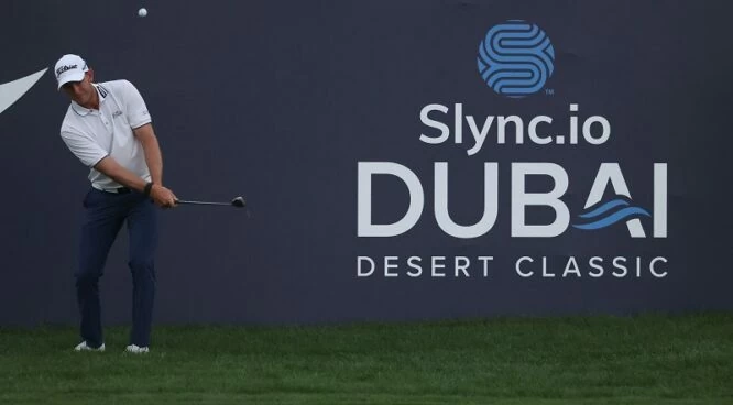 JB Hansen of Denmark plays his chip shot on the 18th hole during day one of the Slync.io Dubai Desert Classic at Emirates Golf Club on January 27, 2022 in Dubai, United Arab Emirates. (Photo by Warren Little/Getty Images)