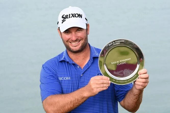 Ryan Fox of New Zealand poses with the trophy following his victory during day four of the Ras Al Khaimah Classic at Al Hamra Golf Club on February 13, 2022 in Ras al Khaimah, United Arab Emirates. (Photo by Ross Kinnaird/Getty Images)