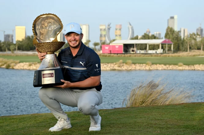 Ewen Ferguson of Scotland celebrates with the winners trophy after the final round of the Commercial Bank Qatar Masters at Doha Golf Club on March 27, 2022 in Doha, Qatar. (Photo by Stuart Franklin/Getty Images)