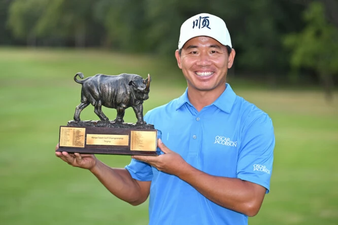 Ashun Wu of China poses with the Magical Kenya Open trophy during day four of the Magical Kenya Open at Muthaiga Golf Club on March 06, 2022 in Nairobi, Kenya. (Photo by Stuart Franklin/Getty Images)