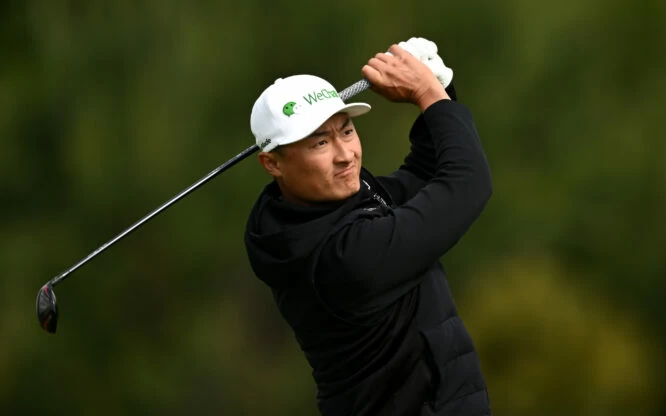 Haotong Li of China plays his second shot on the 11th hole during the first round of the Porsche European Open at Green Eagle Golf Course on June 02, 2022 in Hamburg, Germany. (Photo by Stuart Franklin/Getty Images)