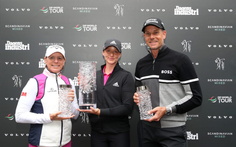 Linn Grant of Sweden is presented with the trophy by tournament hosts Annika Sorenstam and Henrik Stenson after victory on Day Four of the Volvo Car Scandinavian Mixed Hosted by Henrik and Annika at Halmstad Golf Club on June 12, 2022 in Halmstad, Sweden. (Photo by Jan Kruger/Getty Images)