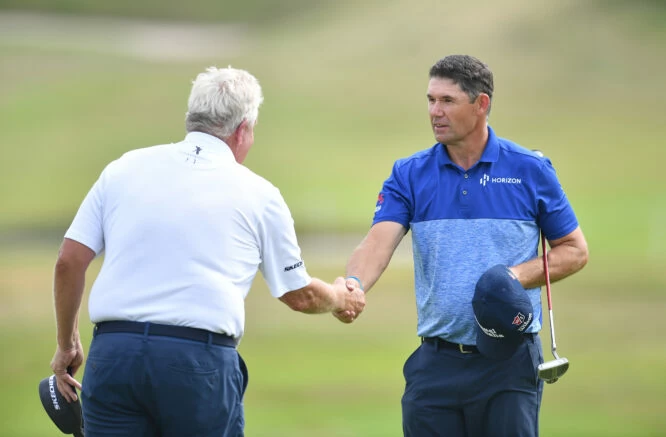 Padraig Harrington of Ireland shakes hands with Colin Montgomery of Scotland as they finish their round prior to The Senior Open Presented by Rolex at The King's Course on July 19, 2022 in Gleneagles, United Kingdom. (Photo by Mark Runnacles/Getty Images)