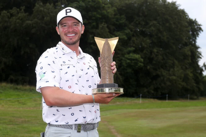 Ewen Ferguson of Scotland poses for a photograph with the trophy after winning the Men's ISPS Handa World Invitational on Day Four of the ISPS Handa World Invitational presented by AVIV Clinics at Galgorm Castle and Massereene Golf Clubs on August 14, 2022 in Co Antrim, Northern Ireland. (Photo by Oisin Keniry/Getty Images)