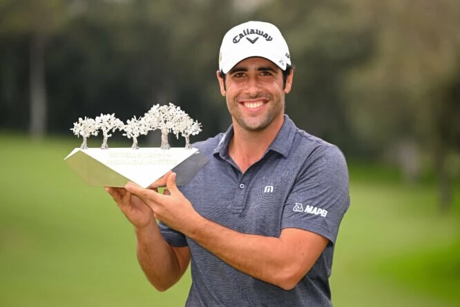 Adrián Otaegui of Spain poses for a photograph as they celebrate with the Andalucia Masters Trophy on day four of the Estrella Damm N.A. Andalucía Masters at Real Club Valderrama on October 16, 2022 in Cadiz, Spain. (Photo by Ross Kinnaird/Getty Images)