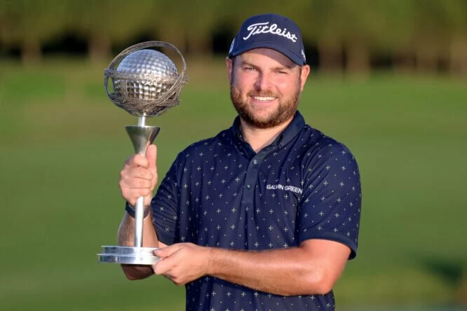 Jordan Smith of England poses for a photograph with the trophy after winning the Portugal Masters during Day Four of the Portugal Masters at Dom Pedro Victoria Golf Course on October 30, 2022 in Quarteira, Portugal. (Photo by Warren Little/Getty Images)
