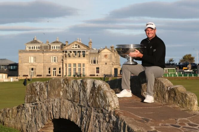 Ryan Fox of New Zealand poses with the trophy on the Swilcan Bridge on the 18th hole after winning the Alfred Dunhill Links Championship on the Old Course St. Andrews on October 02, 2022 in St Andrews, Scotland. (Photo by Jan Kruger/Getty Images)