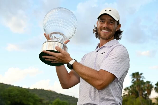Tommy Fleetwood of England poses with the Nedbank Golf Challenge trophy after winning the Nedbank Golf Challenge on the 18th hole during Day Four of the Nedbank Golf Challenge at Gary Player CC on November 13, 2022 in Sun City, South Africa. (Photo by Stuart Franklin/Getty Images)