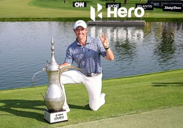 Rory McIlroy of Northern Ireland celebrates with the winners trophy on the 18th green after the final round of the Hero Dubai Desert Classic at Emirates Golf Club on January 30, 2023 in Dubai, United Arab Emirates. (Photo by Ross Kinnaird/Getty Images)