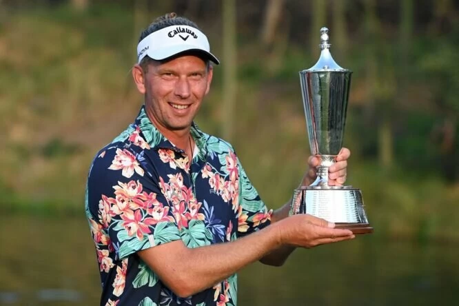 Germanys Marcel Siem poses with the trophy after winning the European Tour of the Hero Indian Open golf tournament in Gurgaon on February 26, 2023. (Photo by Sajjad Hussain/AFP via Getty Images)