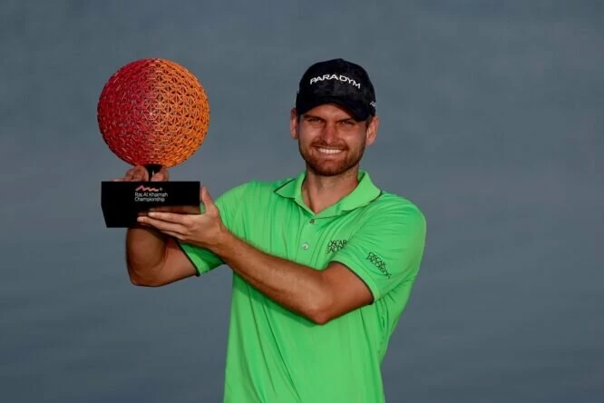 Daniel Gavins of England poses with the Ras Al Khaimah Championship trophy on Day Four of the Ras Al Khaimah Championship at Al Hamra Golf Club on February 05, 2023 in Ras al Khaimah, United Arab Emirates. (Photo by Warren Little/Getty Images)