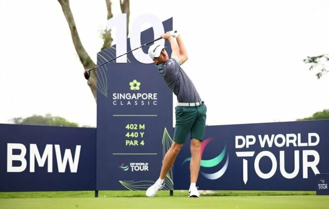Tom McKibbin of Northern Ireland tees off on the 10th hole during Day One of the Singapore Classic at Laguna National Golf Resort Club on February 09, 2023 in Singapore. (Photo by Yong Teck Lim/Getty Images)