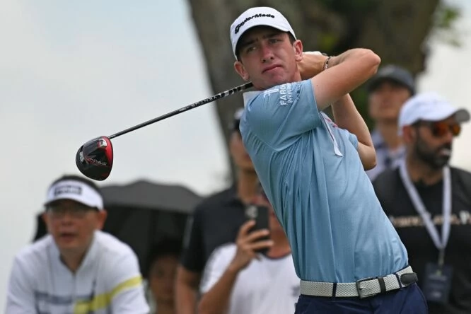 Tom McKibbin of Northern Ireland hits a tee-off during round two of the DP World Tour Singapore Classic golf tournament in Singapore on February 10, 2023. (Photo by ROSLAN RAHMAN / AFP) (Photo by ROSLAN RAHMAN/AFP via Getty Images)