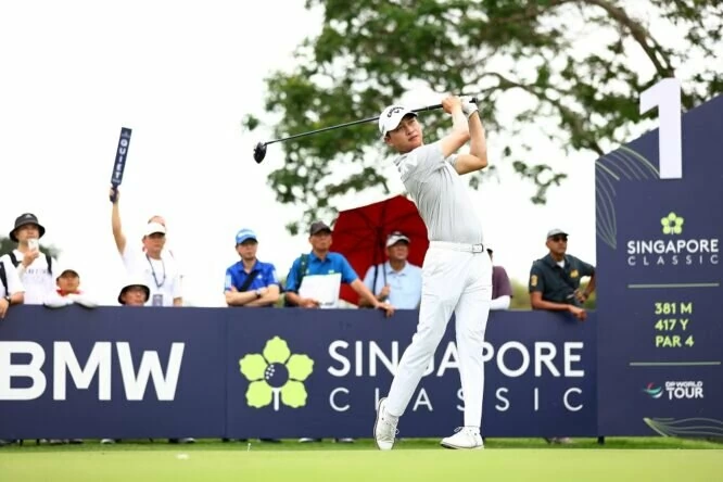 Jeunghun Wang of South Korea plays his shot from the first tee during Day Three of the Singapore Classic at Laguna National Golf Resort Club on February 11, 2023 in Singapore. (Photo by Yong Teck Lim/Getty Images)