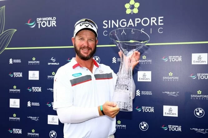 Ockie Strydom of South Africa poses for a picture with the Singapore Classic trophy during Day Four of the Singapore Classic at Laguna National Golf Resort Club on February 12, 2023 in Singapore. (Photo by Yong Teck Lim/Getty Images)