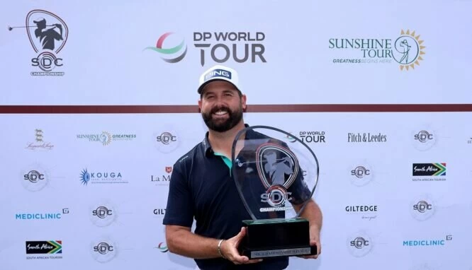 Matthew Baldwin of England celebrates with the winners trophy after the SDC Championship 2023 at St. Francis Links on March 19, 2023 in South Africa. (Photo by Warren Little/Getty Images)