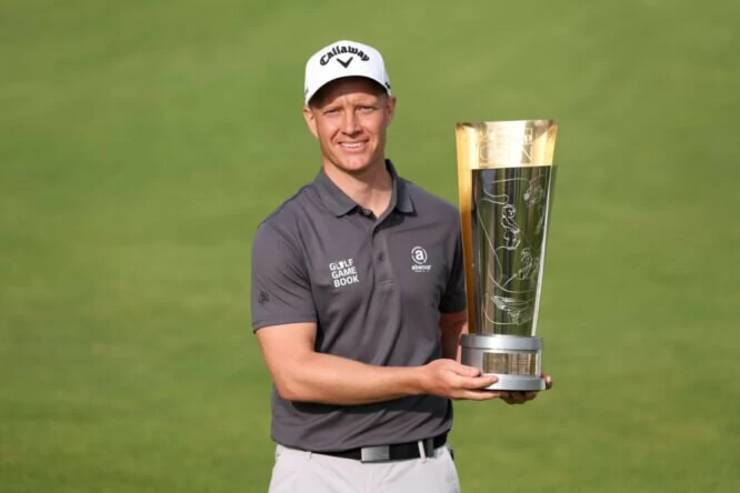 Simon Forsstrom of Sweden poses for a photograph with the trophy following victory during Day Four of the Soudal Open at Rinkven International Golf Club on May 14, 2023 in Belgium. (Photo by Richard Heathcote/Getty Images)
