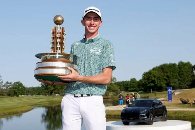 Tom McKibbin of Northern Ireland poses with the trophy after winning the Porsche European Open on the 18th hole on Day Four of the Porsche European Open at Green Eagle Golf Course on June 04, 2023 in Germany. (Photo by Jan Kruger/Getty Images)
