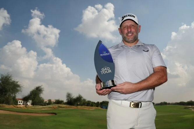 Mike Browne of England celebrates with the G4D trophy following the G4D Tour season finale on Day Three of the DP World Tour Championship on the Earth Course at Jumeirah Golf Estates on November 18, 2023 in Dubai, United Arab Emirates. (Photo by Oisin Keniry/Getty Images)