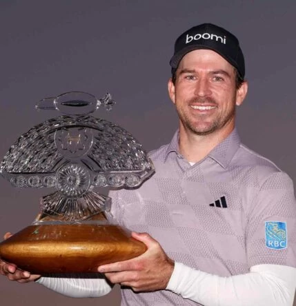Nick Taylor holds the trophy os WM Phoenix Open.