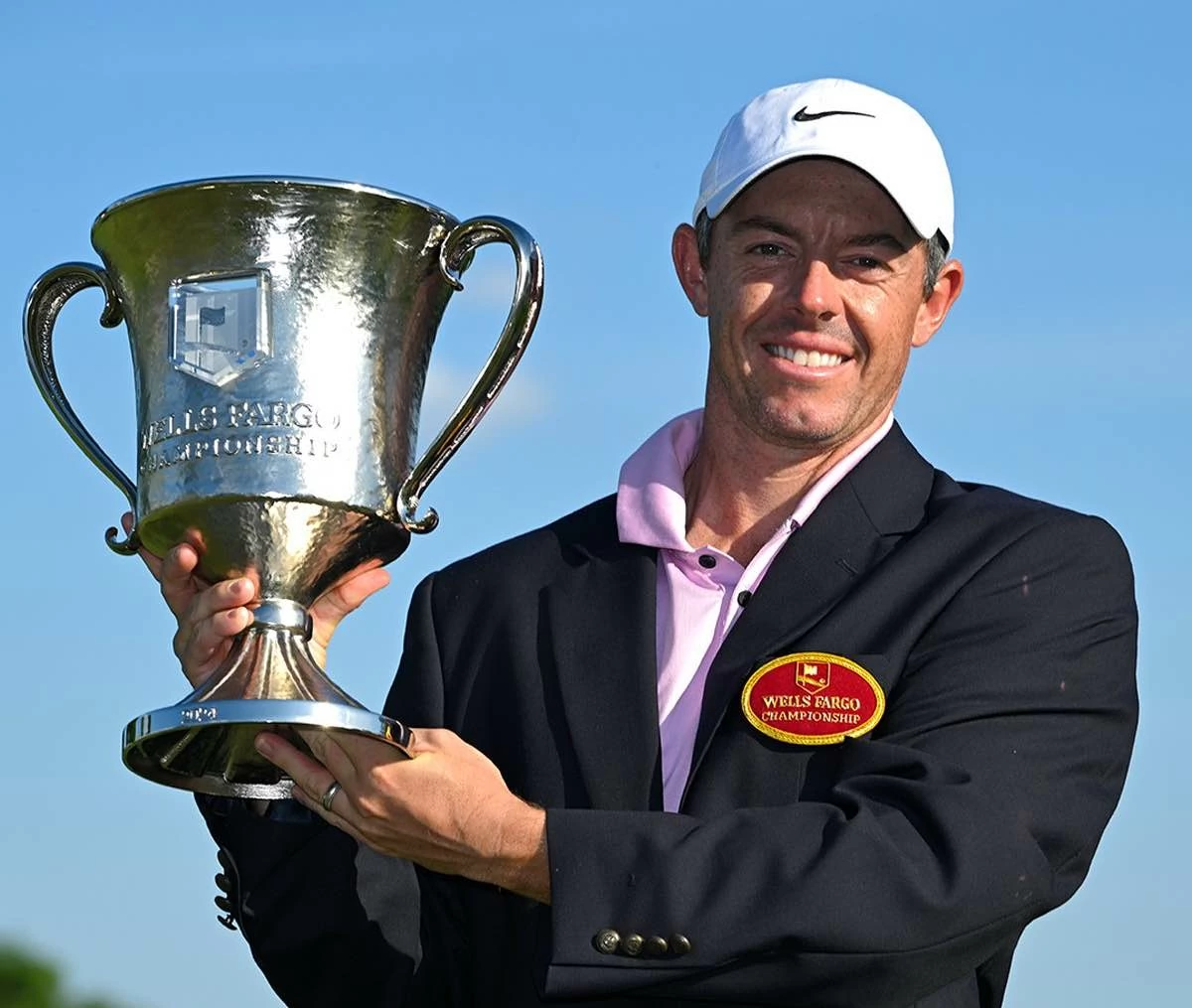 Rory McIlroy holds the Wells Fargo Championship champion trophy. Rory McIlroy holds the Wells Fargo Championship champion trophy.