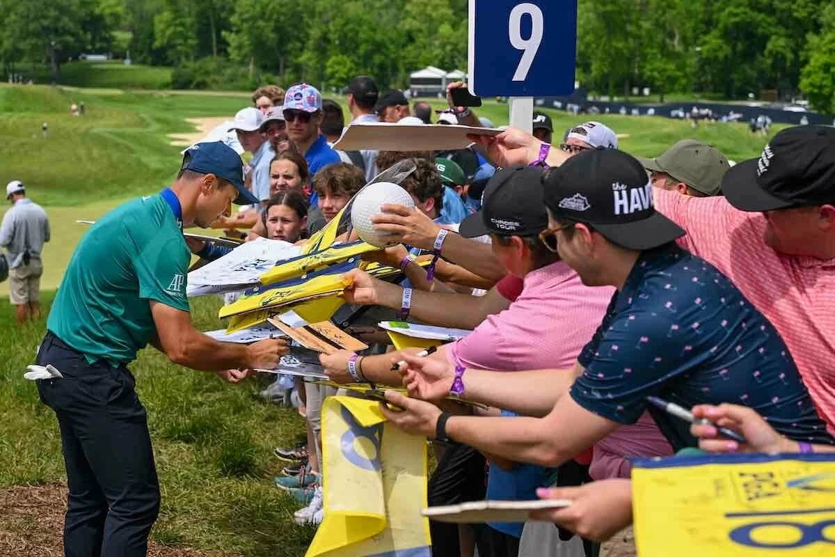 ViktorHovlandpgavalhallagetty24 Viktor Hovland signs autographs during the practice round in Valhalla. (Photo by Ross Kinnaird/Getty Images)