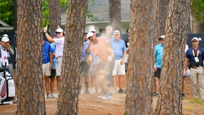 Brooks Koepka hits a shot from the trees on the 5th hole at Pinehurst during the second day of the 2024 US Open. (Logan Whitton/USGA)