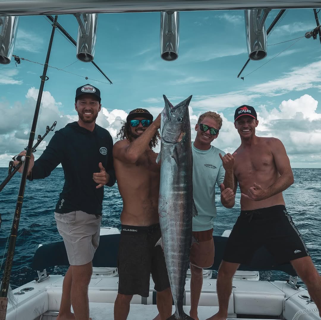 Daniel Berger, with the splint on his finger, fishing with friends