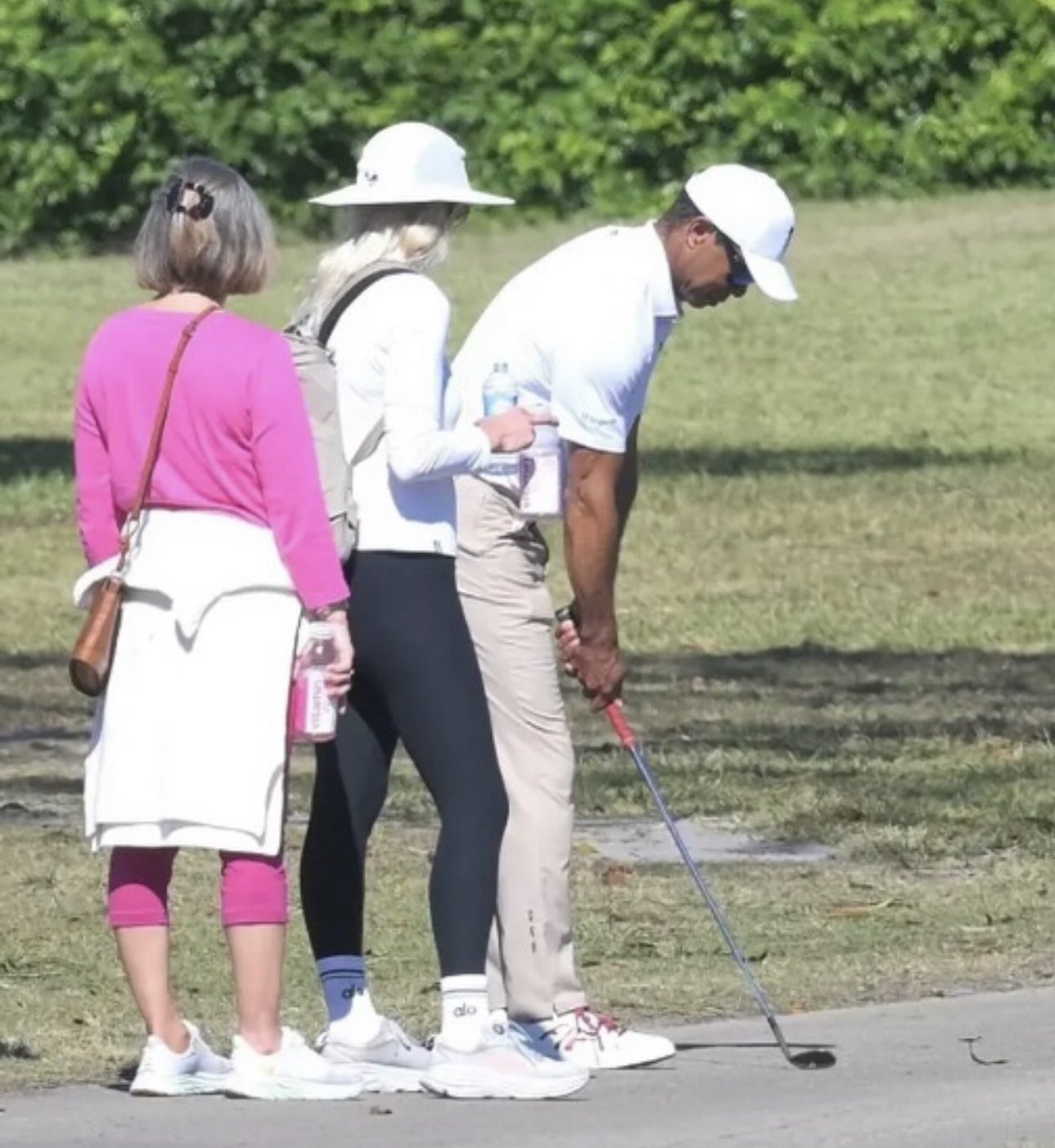 Tiger Woods, testing Charlie's clubs.